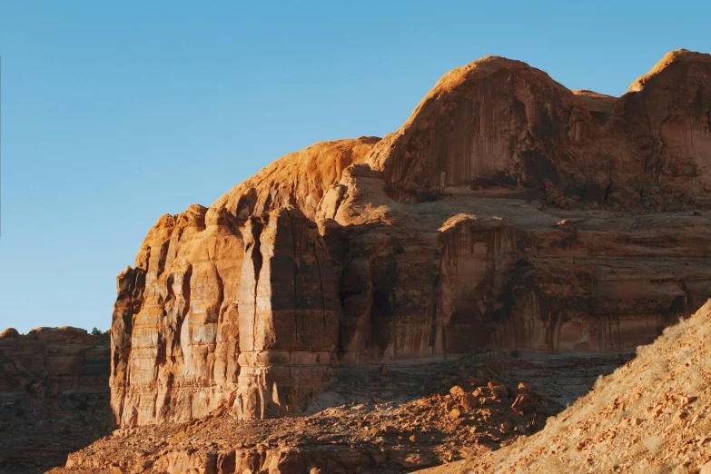 a large mountain with some big rocks in the background