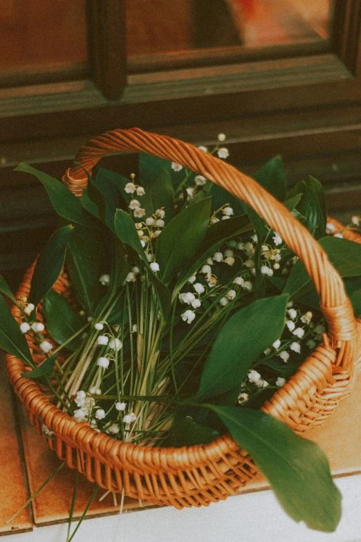 the bouquet of flowers is placed in a basket