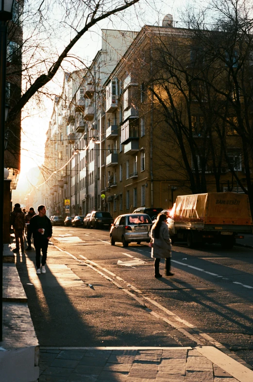 people walking down the street in the distance