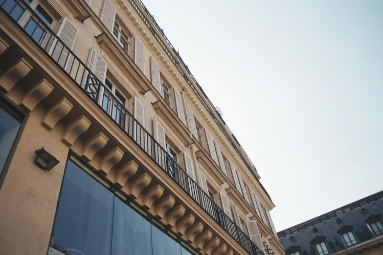 the windows on the building have been closed to let in light