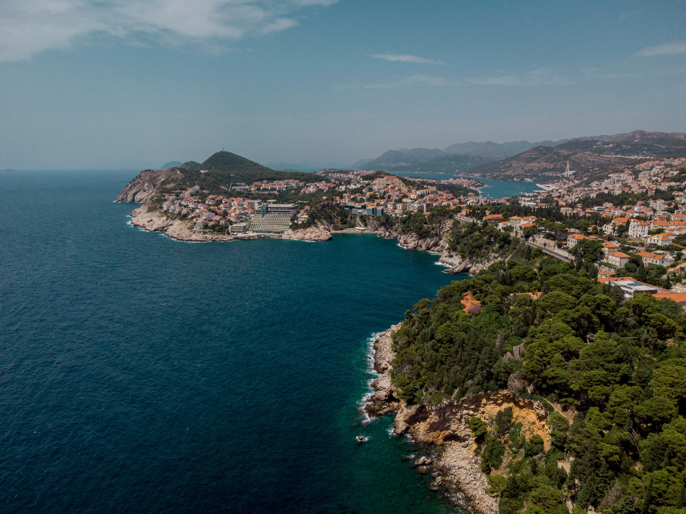 aerial view of an island in the middle of a sea