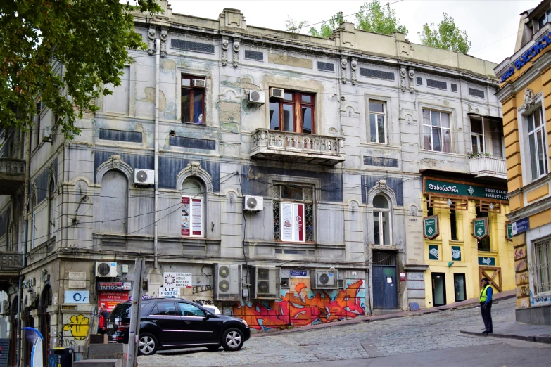 a car parked in front of an old building