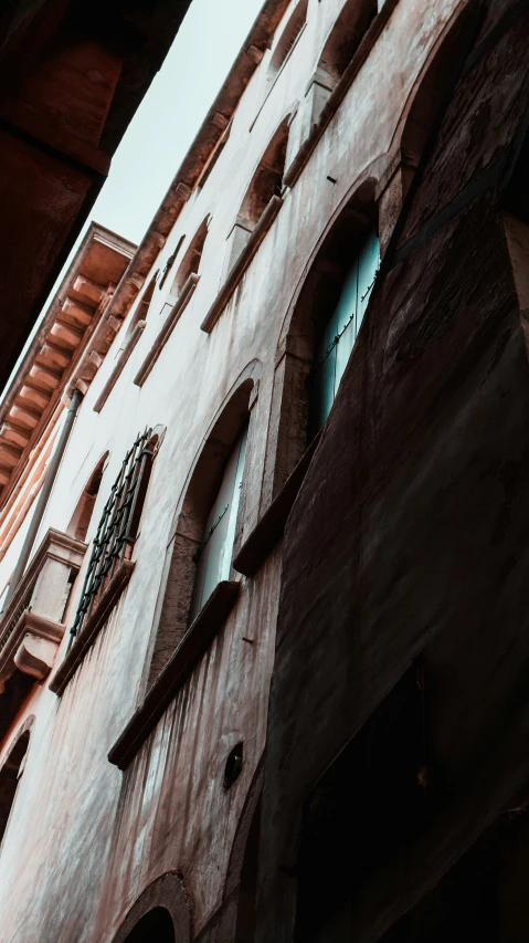 an old building with lots of arched windows