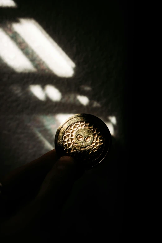 a person holds a small piece of metal in their hands