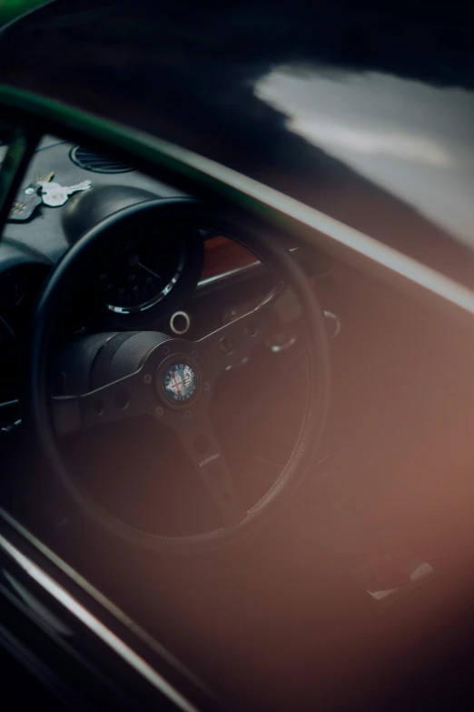 the inside view of a car that is seen through a mirror