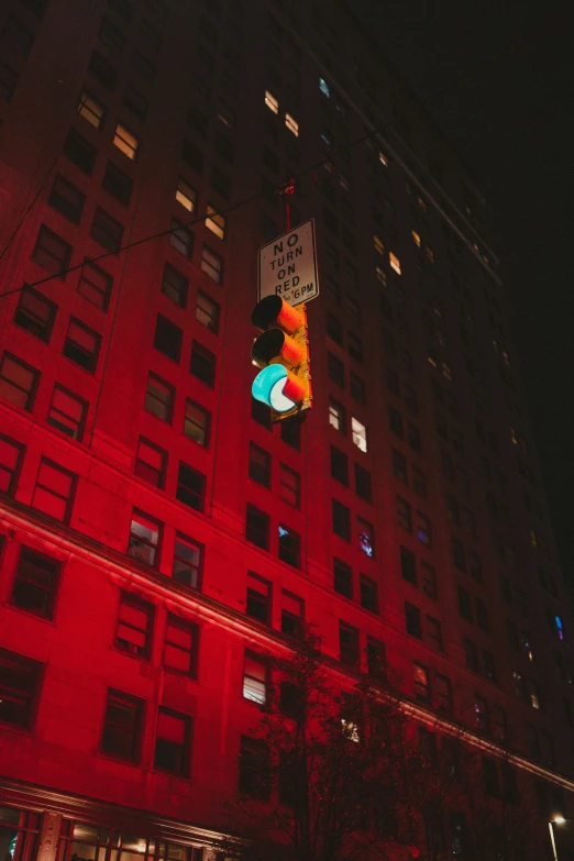 a large brick building with a traffic light