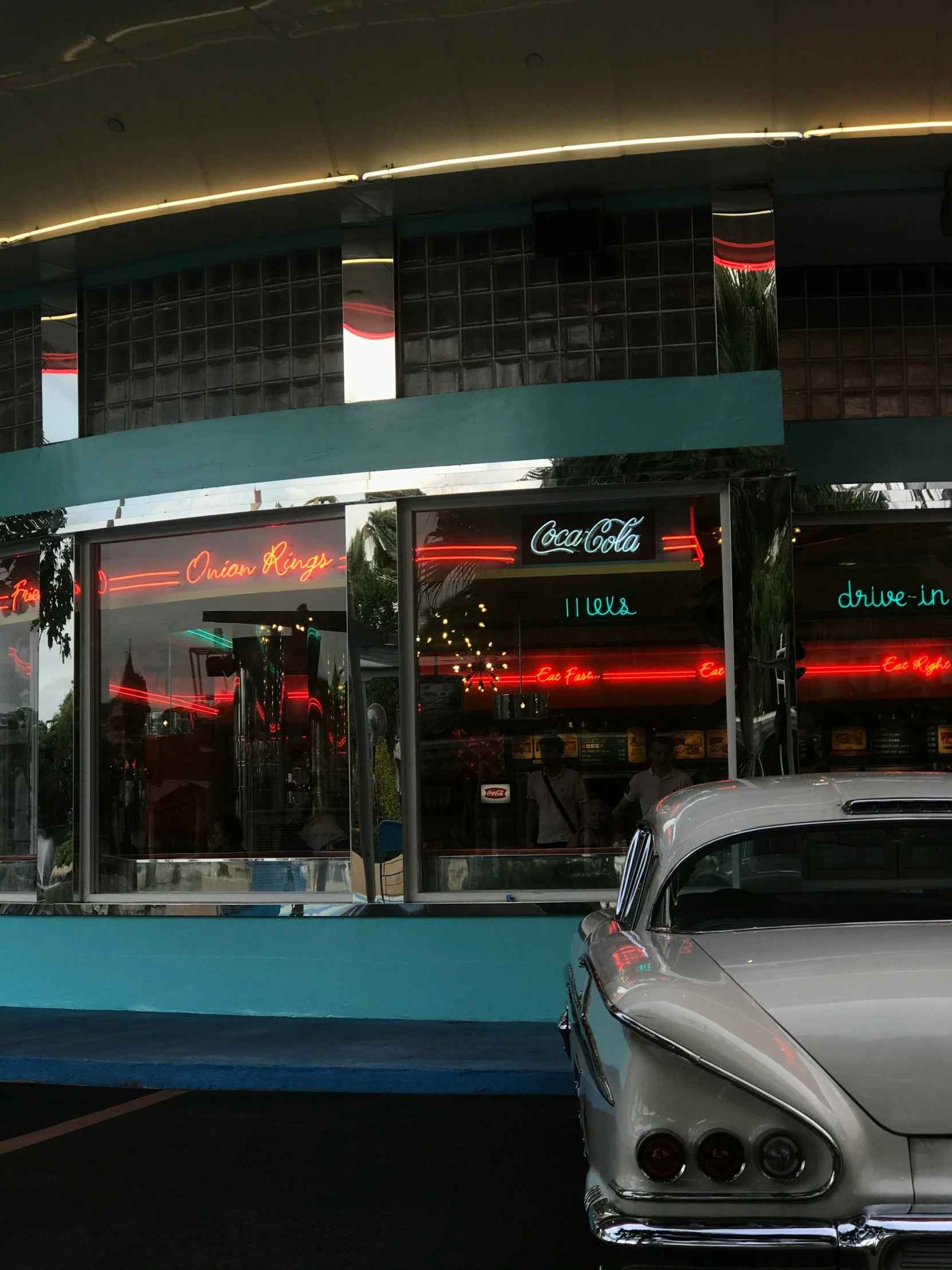 an image of restaurant with car parked at the side