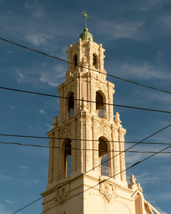 an ornate tower in the middle of blue skies