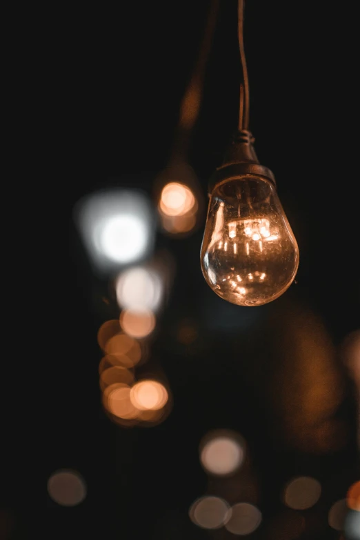 a light bulb that is hanging from a cable