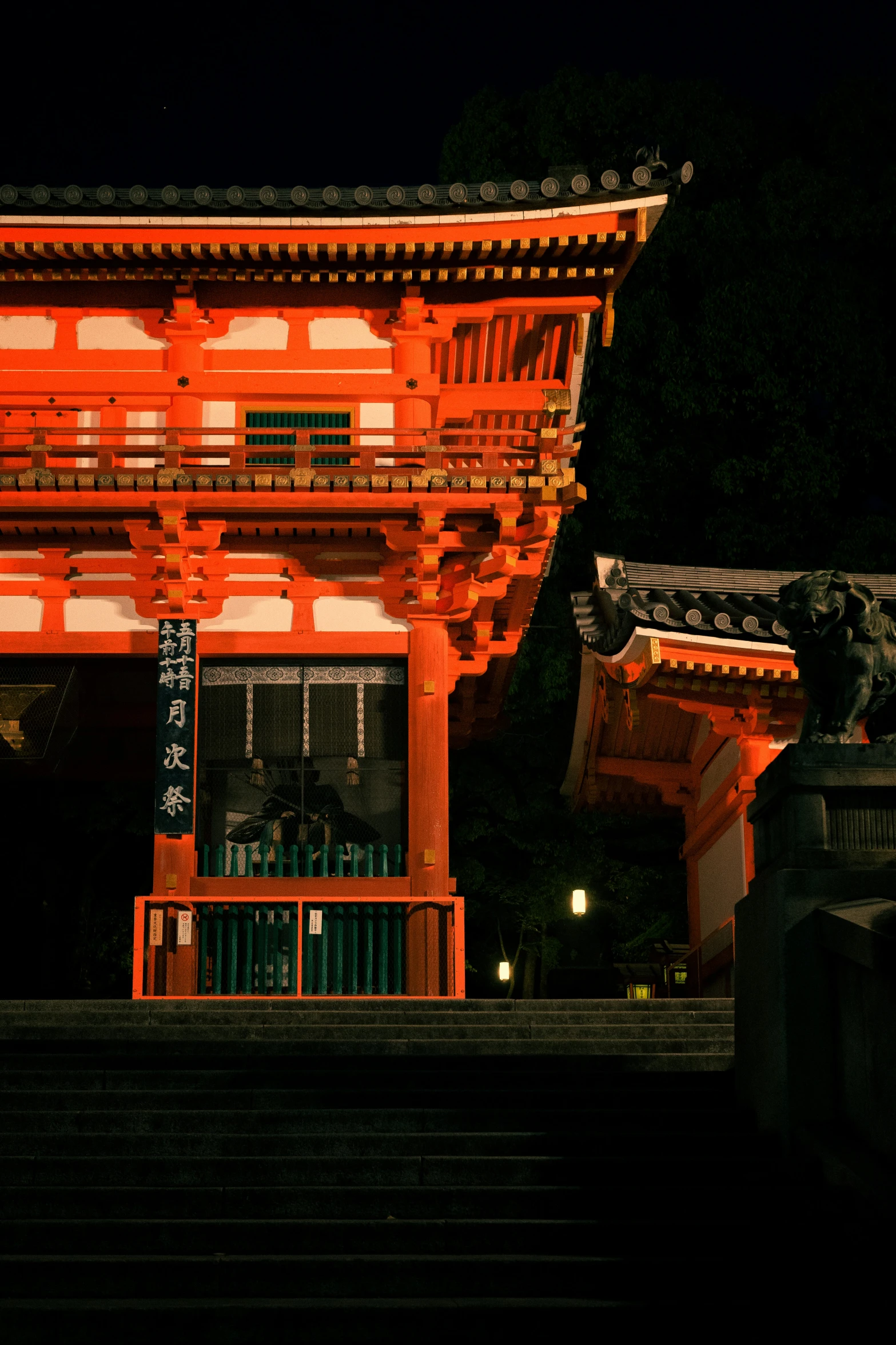 an oriental building with stone stairs and pillars