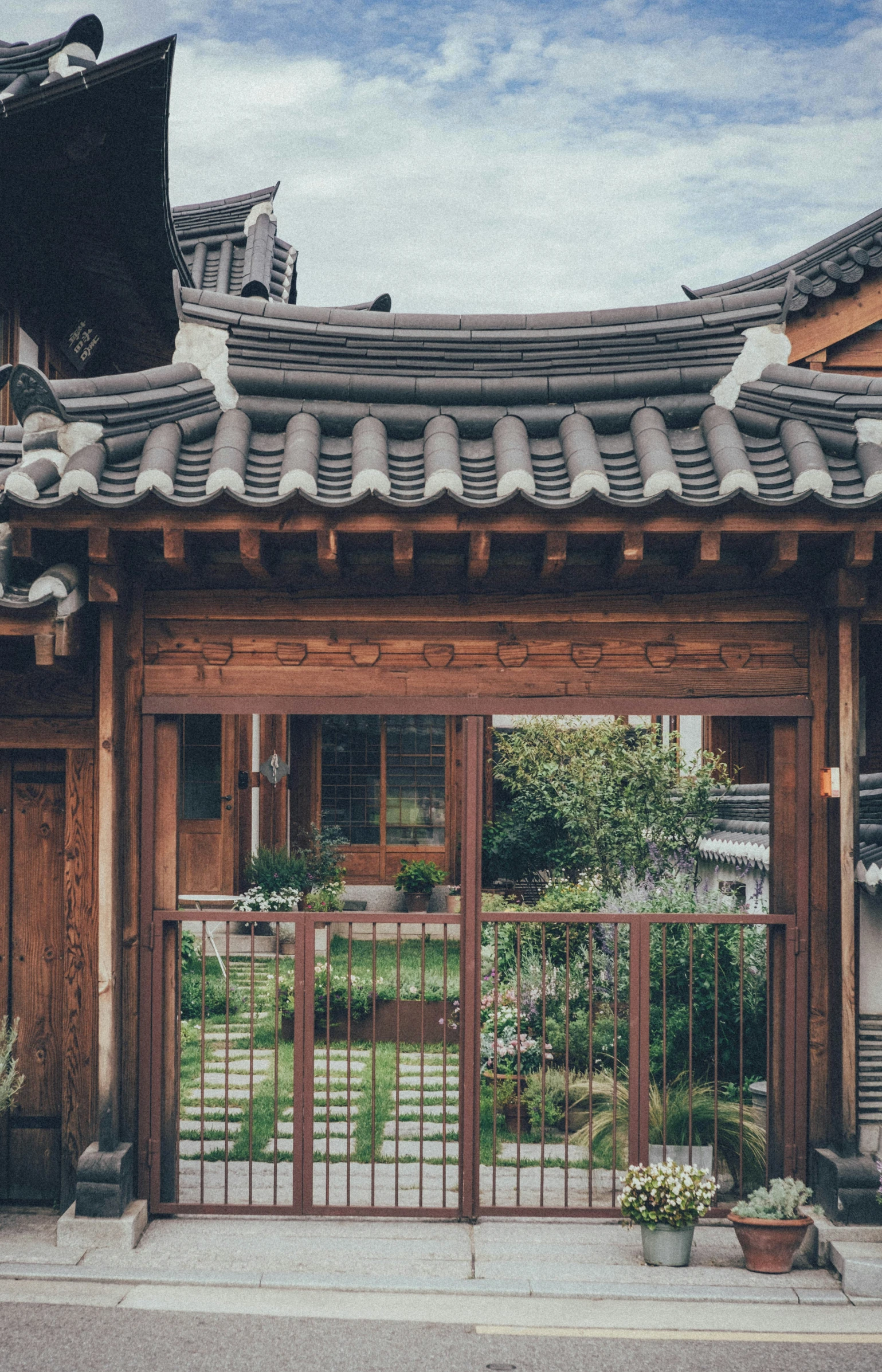 an old japanese style building with an ornate gate