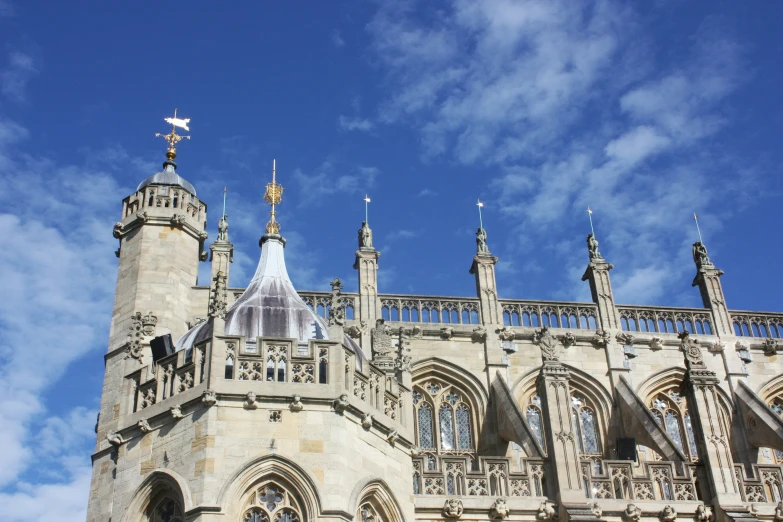 a tall cathedral sitting under a blue sky