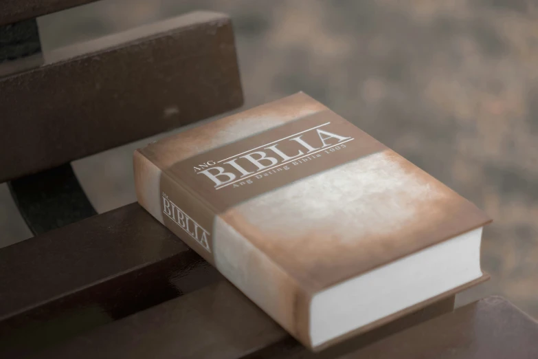 the bible is sitting on top of the table
