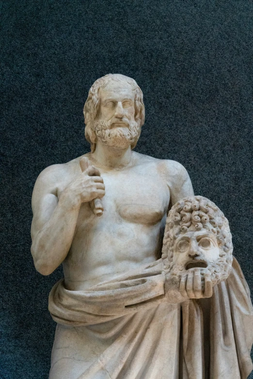 a close up view of a statue with a beard and wearing a hat