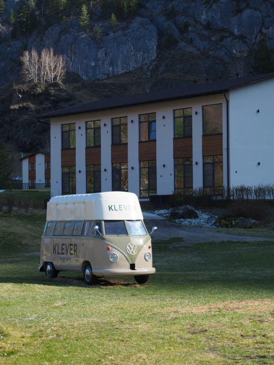 a white van parked in front of a building