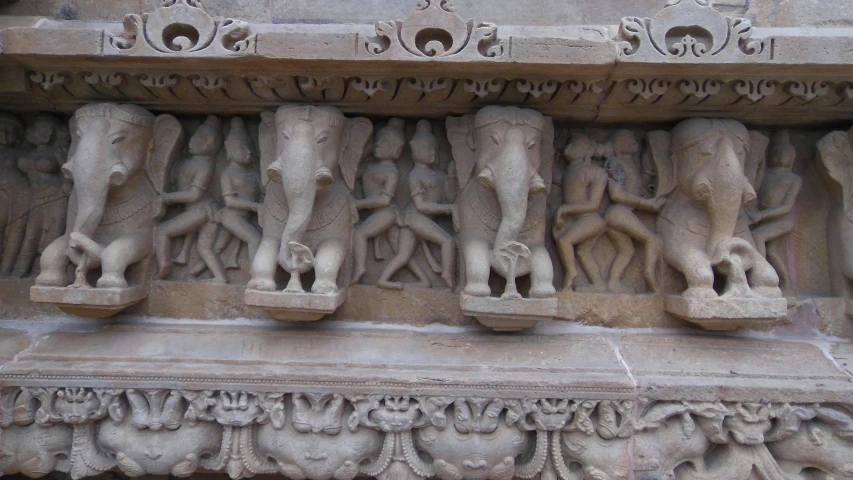 decorative sculptures on the wall of a building