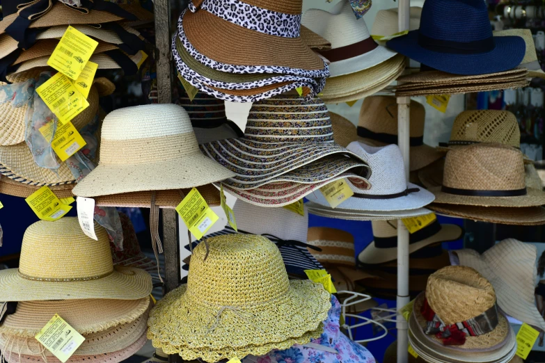 many hats are on display in different colors