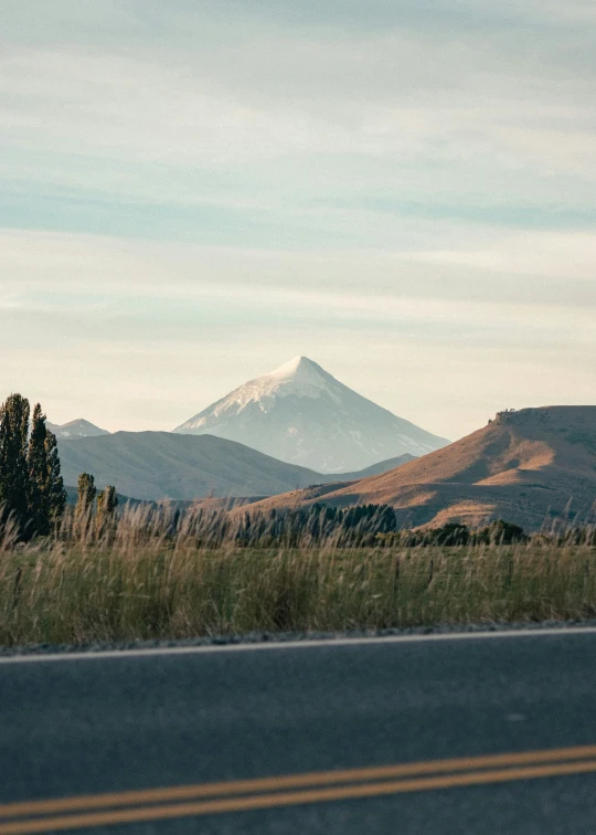 a street view of mountains in the distance