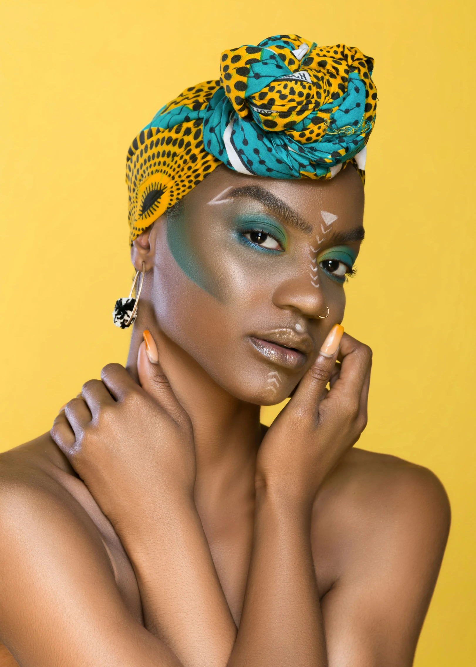 a woman posing for the camera with her hands in her face