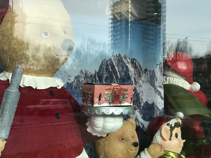 a bunch of stuffed animals are in front of a display