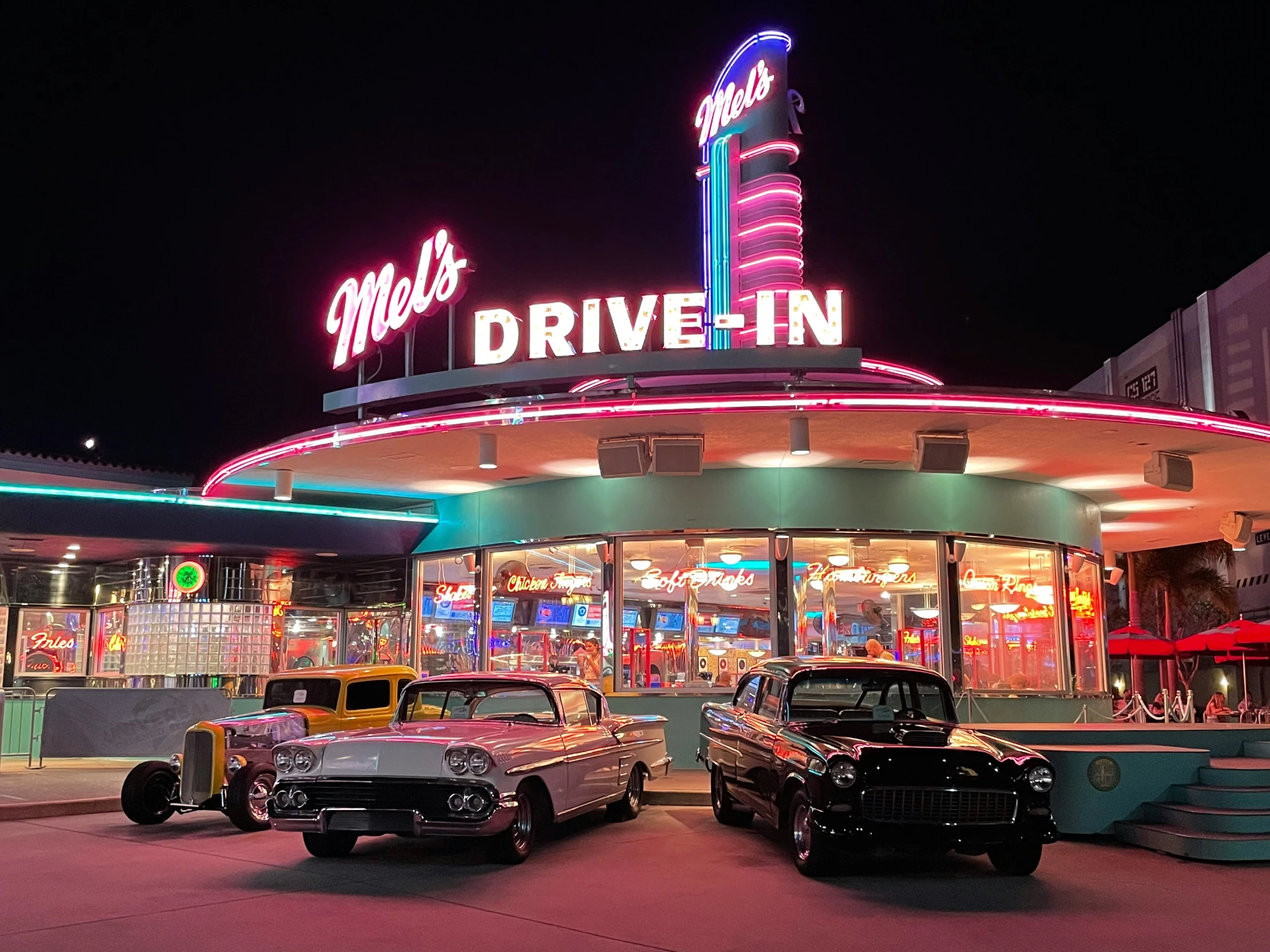 a couple of cars parked in front of a building