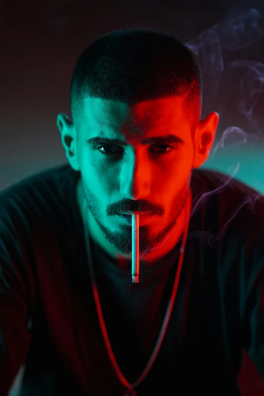 a man is standing in the smoke with a cigarette