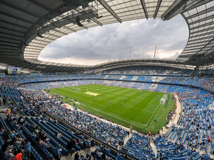 the inside of an empty stadium as a crowd watches