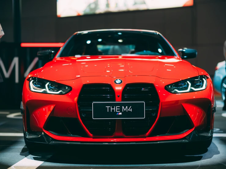 a car is shown on display at an auto show