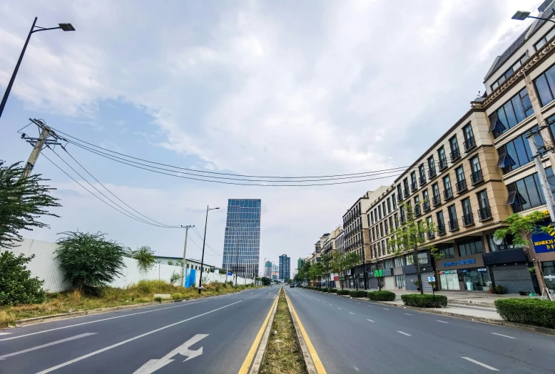 an empty street near an apartment building in the city