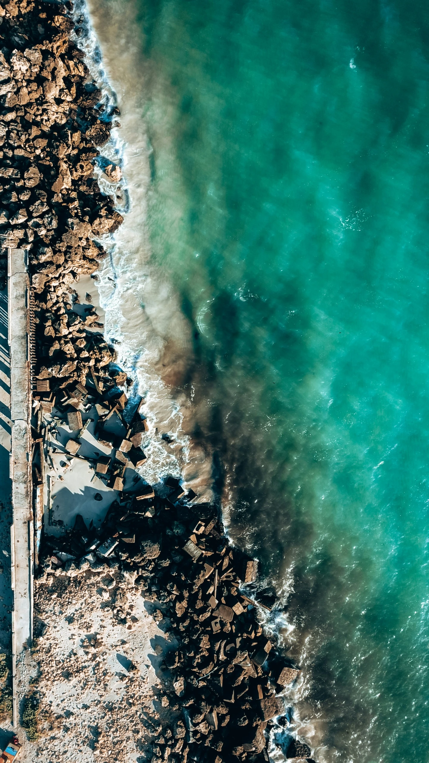 an aerial view of a large body of water and shore