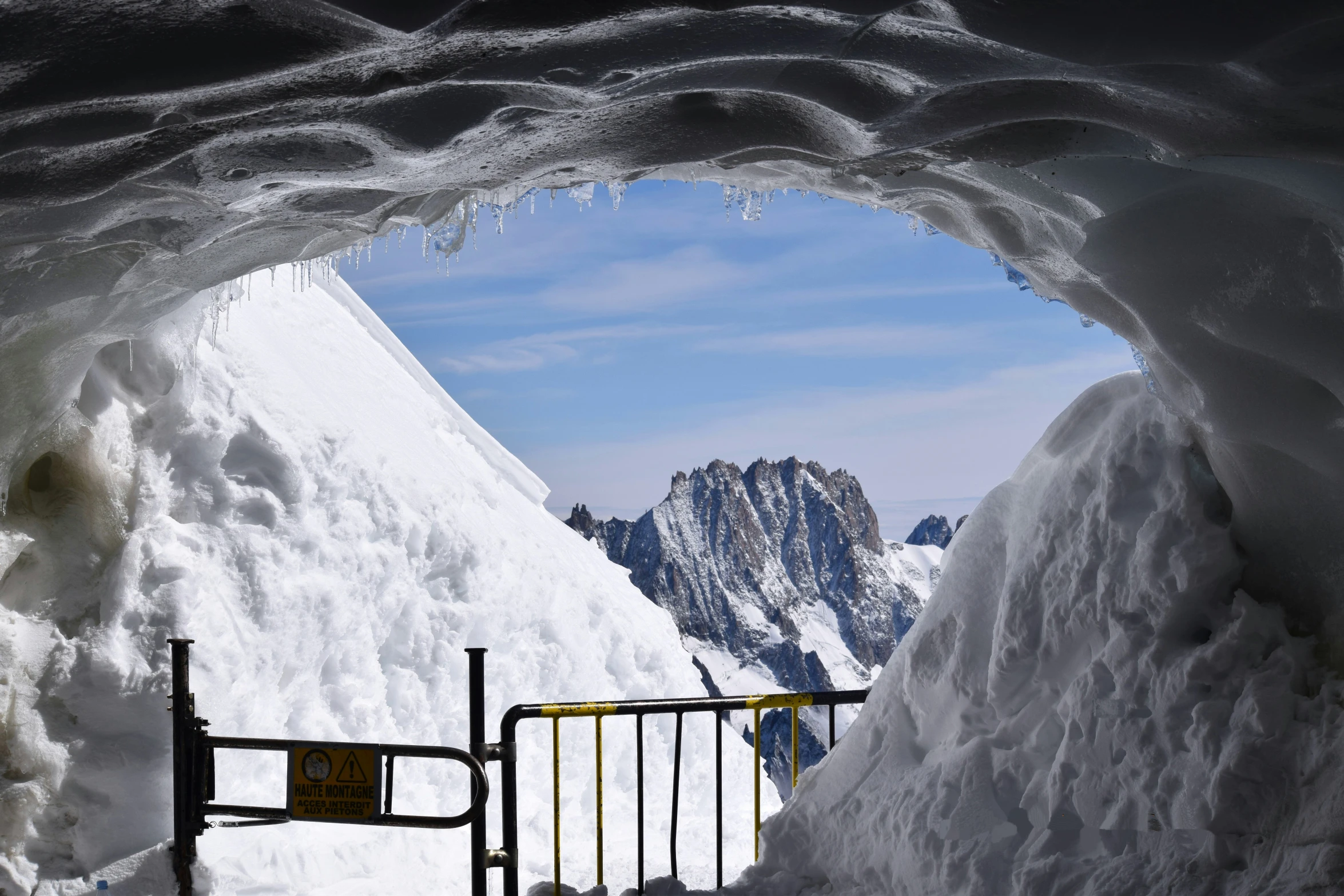 a mountain in the distance is covered with ice