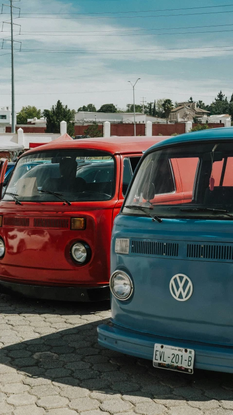 various vehicles are parked in a lot on the road