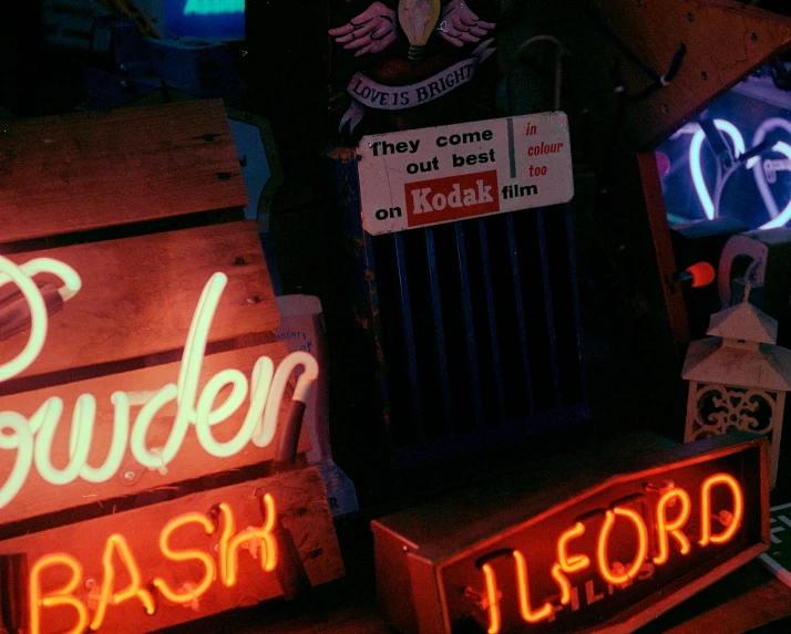 there are some neon signs that are lit up