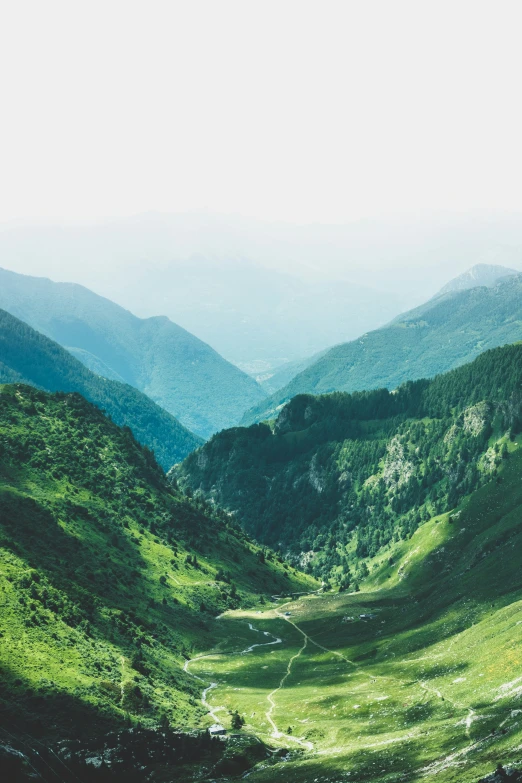 a view of some hills with some hills in the background