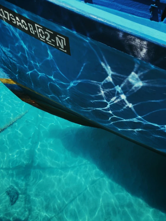 a boat is pulled up to the beach on a sunny day