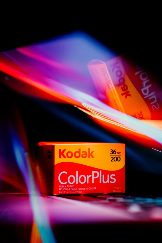 this kodak is sitting on a table with it's side lit up