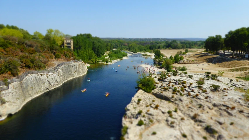 a group of people on canoes glide down a river