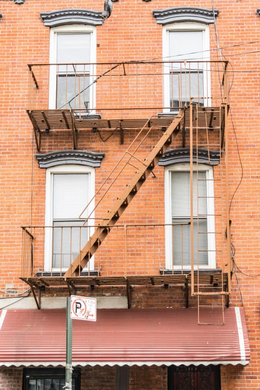 the fire escape is next to an apartment building