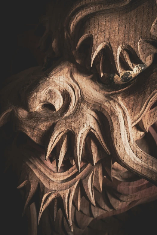 a close up of an intricate carved wooden sculpture