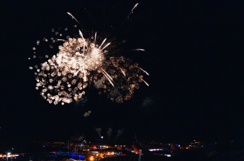 fireworks are lit up in the night sky