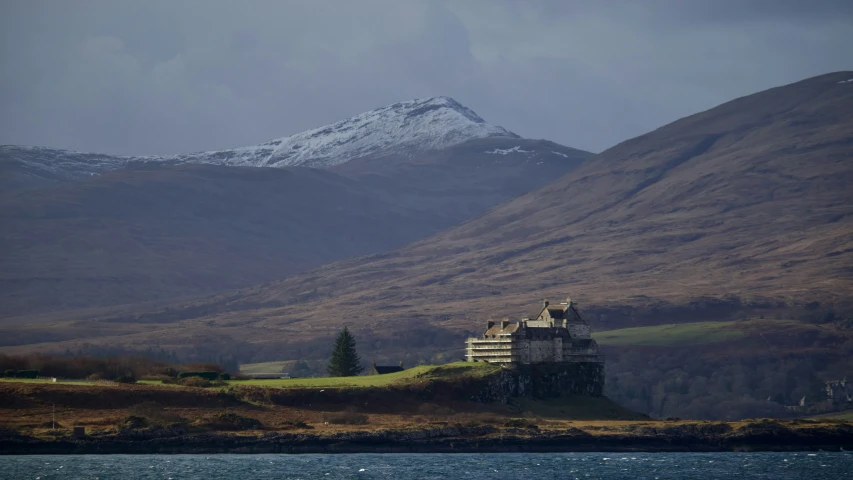 an image of a house with a mountain in the background