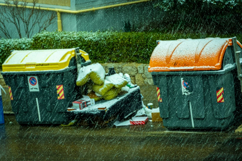 trashcans outside in the snow during winter