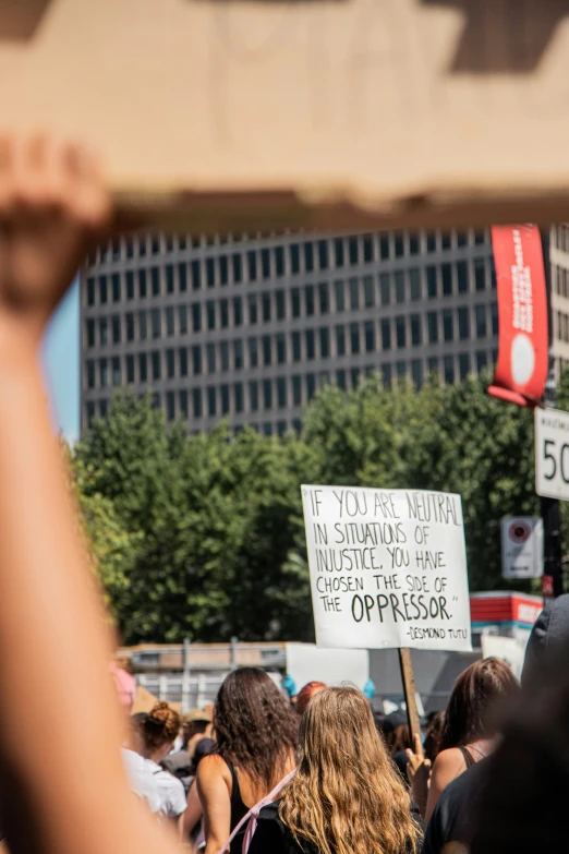 several people are protesting in a street