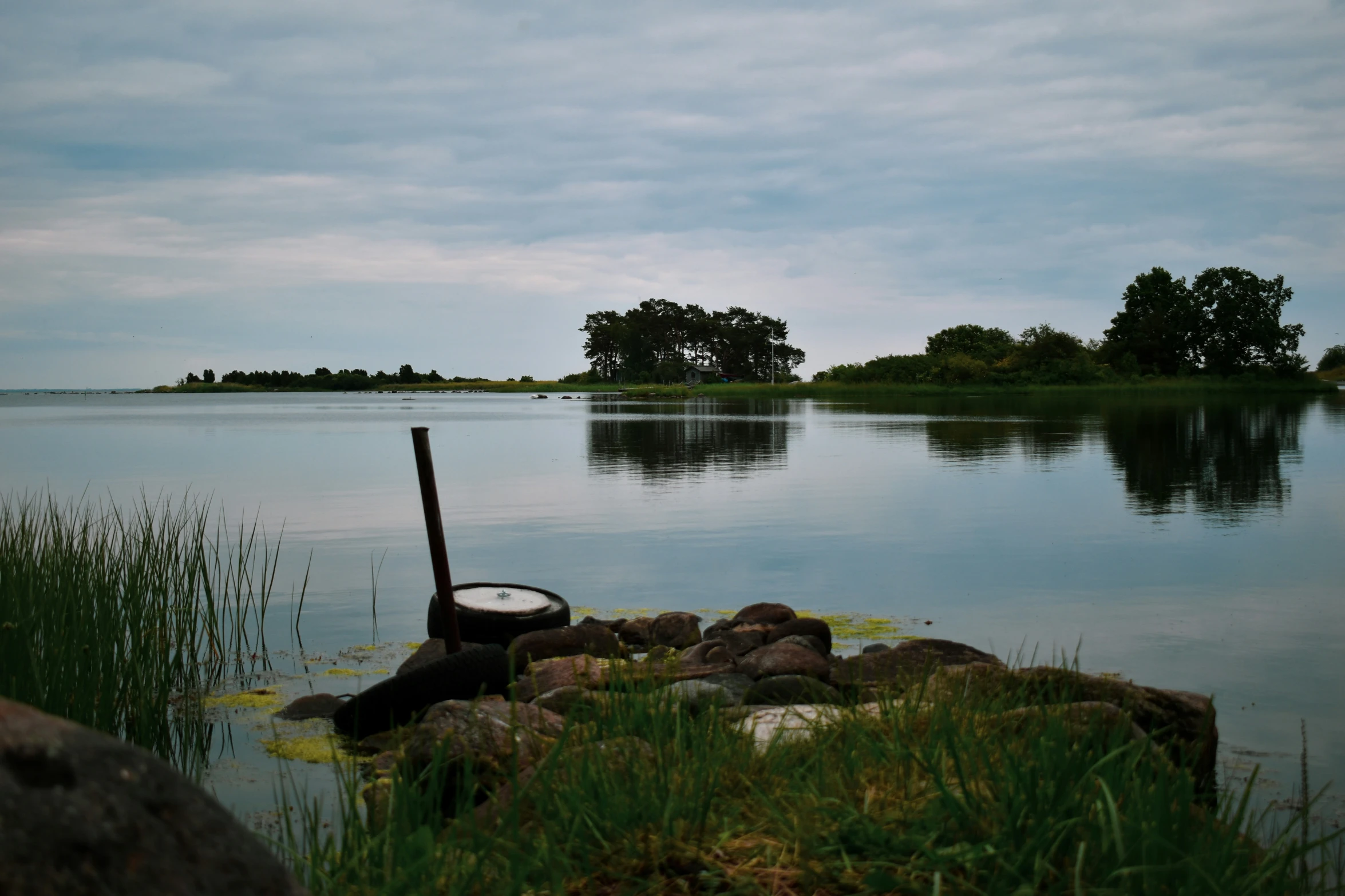 an old fashioned boat sits on the shore