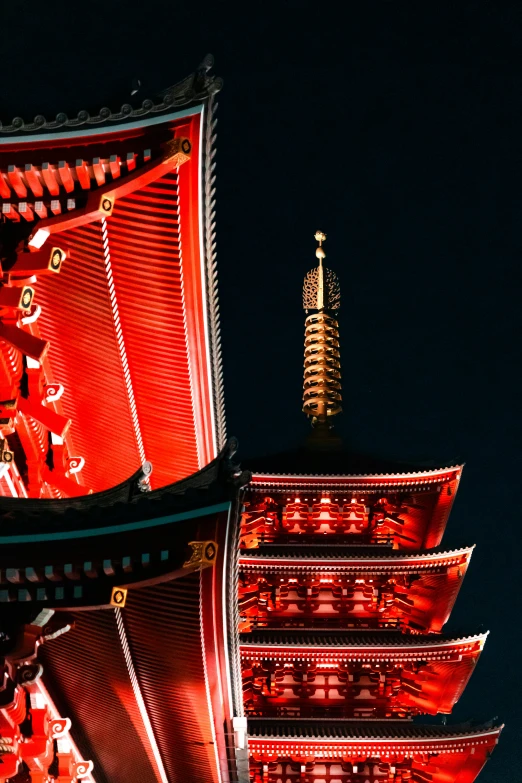 a tall building with a very bright red light