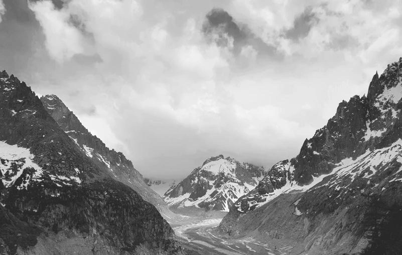 black and white image of a snow covered mountain