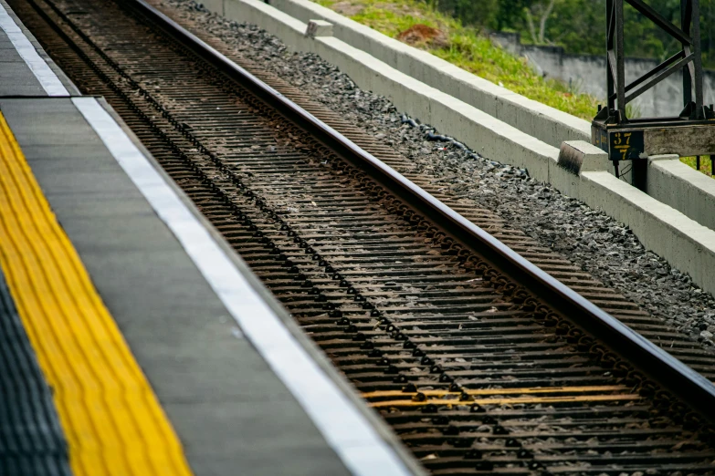 a view down the tracks at a train station