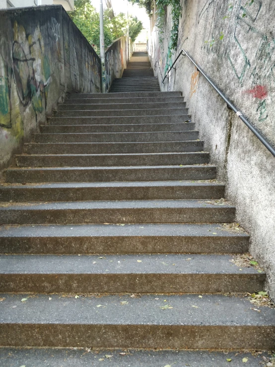 steps lead down to the bottom of some concrete stairs