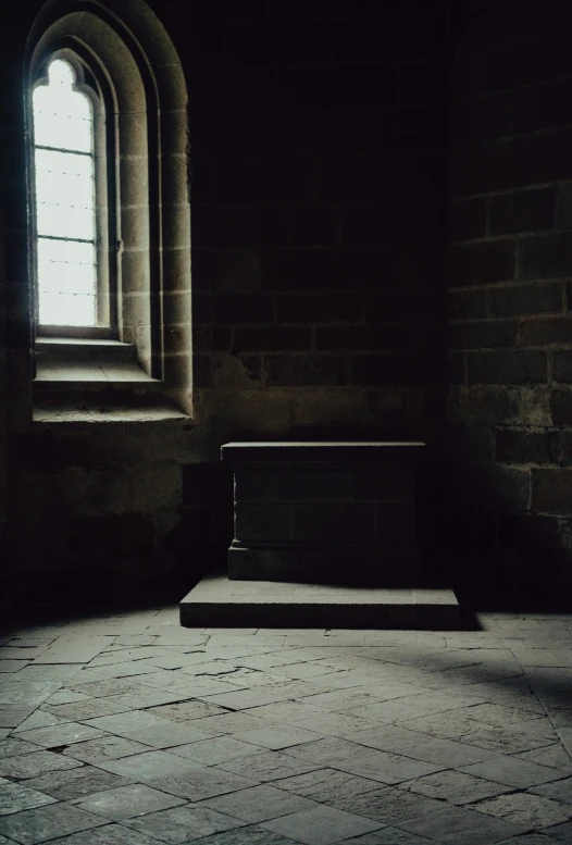 an empty bench sitting in the middle of an old building