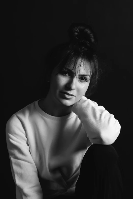 black and white pograph of a woman posing for the camera